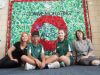 Art teacher Merranie Beal with headboy Akshay Sundru, headgirl Paris Scoby-Smith and principal Patricia Joss in front of the school’s mural. Photograph — Matt Devlin.