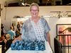 Trudi Pollard with her award winning piece Indigo Scrolls. Photograph — Kelly Pilgrim-Byrne.