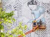 Italian street artist Millo painting a piece on the TL Robertson library at Curtin University last week. Photograph — Matt Devlin.