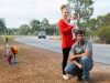 Adam, Lotti and Emilia Fairey at the S-bend outside their property, which has been the scene of three major crashes in six months. Photograph — Matt Devlin.