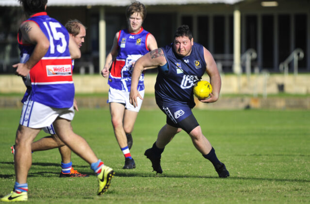 Footy players in action