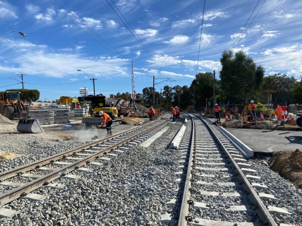 Rail workers work on the track