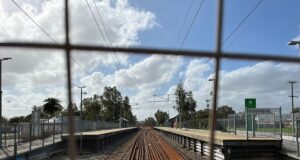 A train station behind a fence