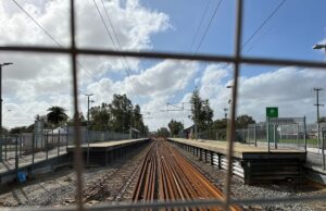 A train station behind a fence